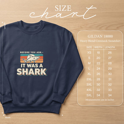 Navy crewneck sweatshirt with "It Was A Shark" graphic and Gildan 18000 size chart.