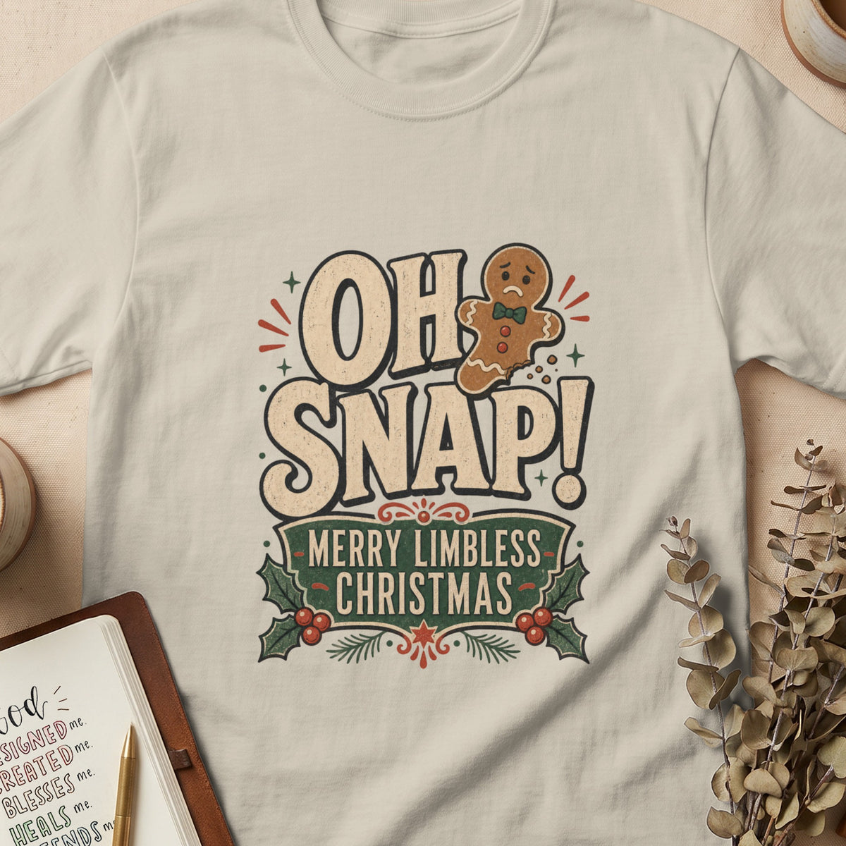 Gingerbread man missing limbs on shirt with text "OH SNAP! MERRY LIMBLESS CHRISTMAS".