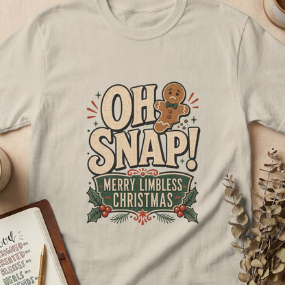 Gingerbread man missing limbs on shirt with text "OH SNAP! MERRY LIMBLESS CHRISTMAS".