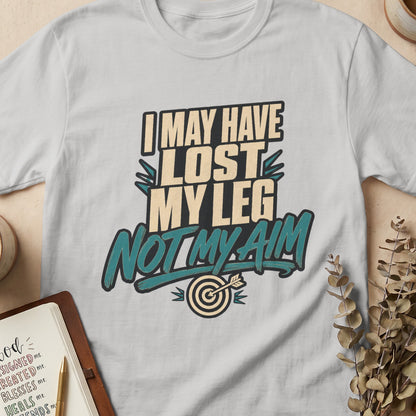 Light gray t-shirt with text "I MAY HAVE LOST MY LEG NOT MY AIM" and a target.
