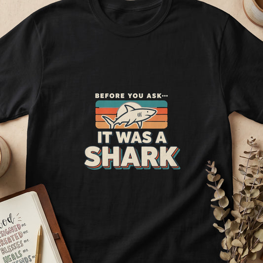 Black t-shirt with "BEFORE YOU ASK... IT WAS A SHARK" graphic.