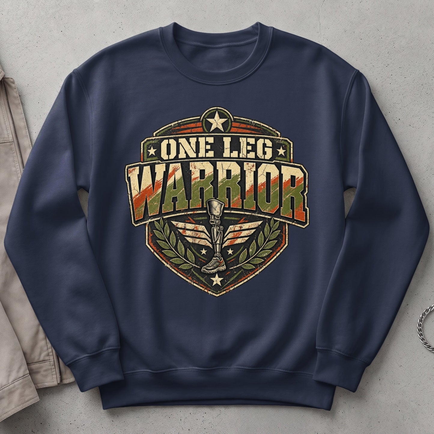Navy sweatshirt with "One Leg Warrior" graphic featuring a prosthetic leg and laurel wreath.