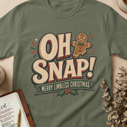 Green t-shirt with "OH SNAP! MERRY LIMBLESS CHRISTMAS" and a sad gingerbread man.