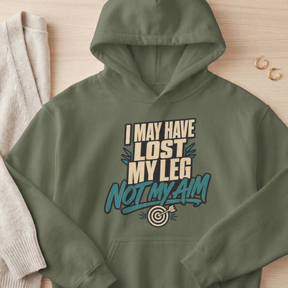 Olive green hoodie with text "I MAY HAVE LOST MY LEG NOT MY AIM" and a dartboard graphic.