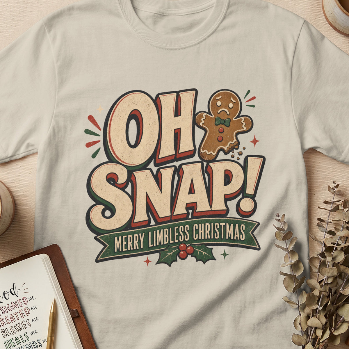 T-shirt with "OH SNAP! MERRY LIMBLESS CHRISTMAS" and a sad gingerbread man.
