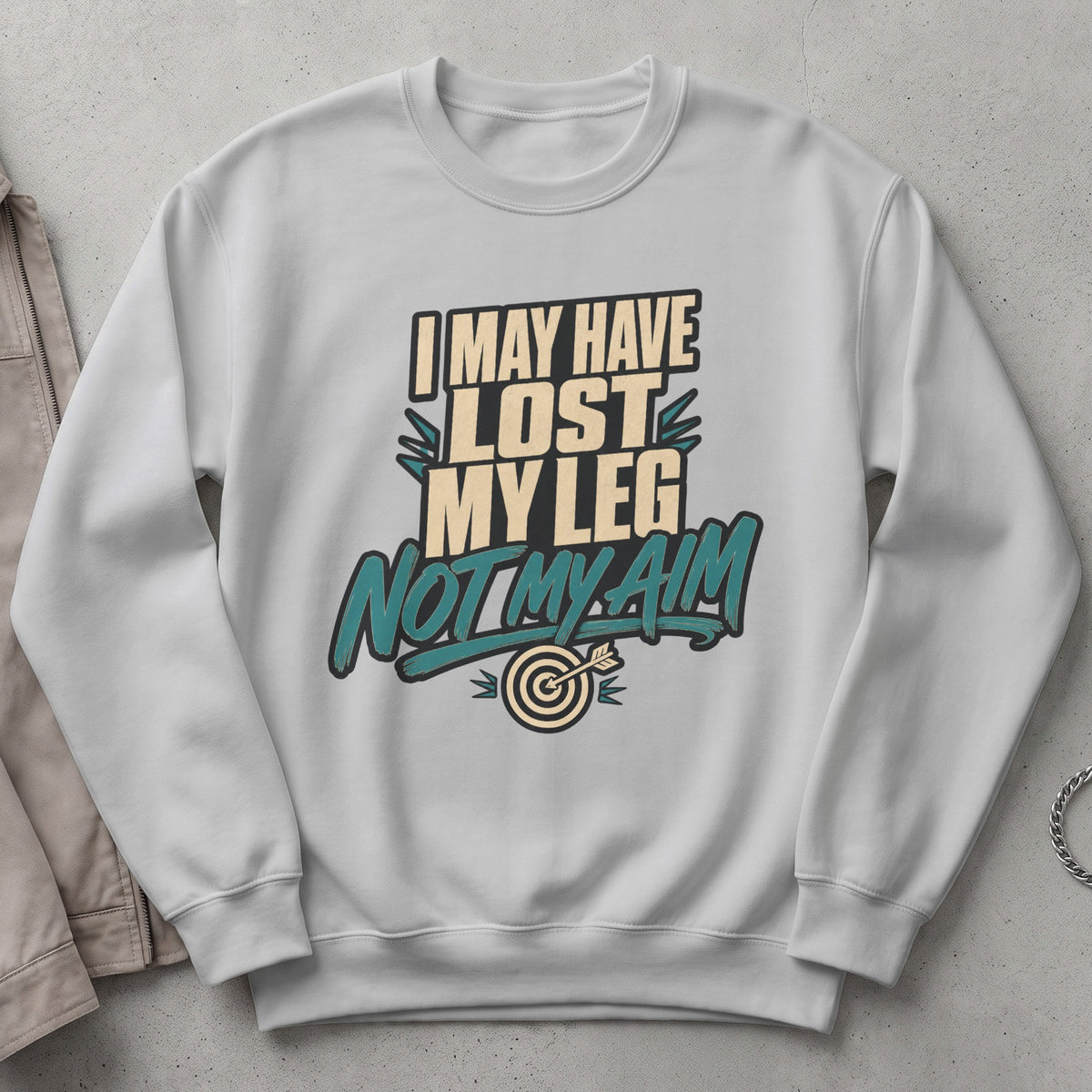White sweatshirt with text: "I MAY HAVE LOST MY LEG NOT MY AIM" and a dartboard graphic.