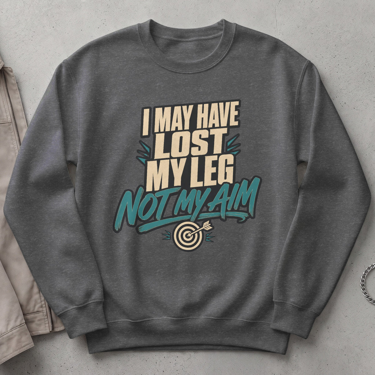 Dark grey sweatshirt with text "I may have lost my leg, not my aim" and a dartboard.
