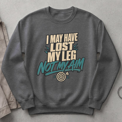 Dark grey sweatshirt with text "I may have lost my leg, not my aim" and a dartboard.