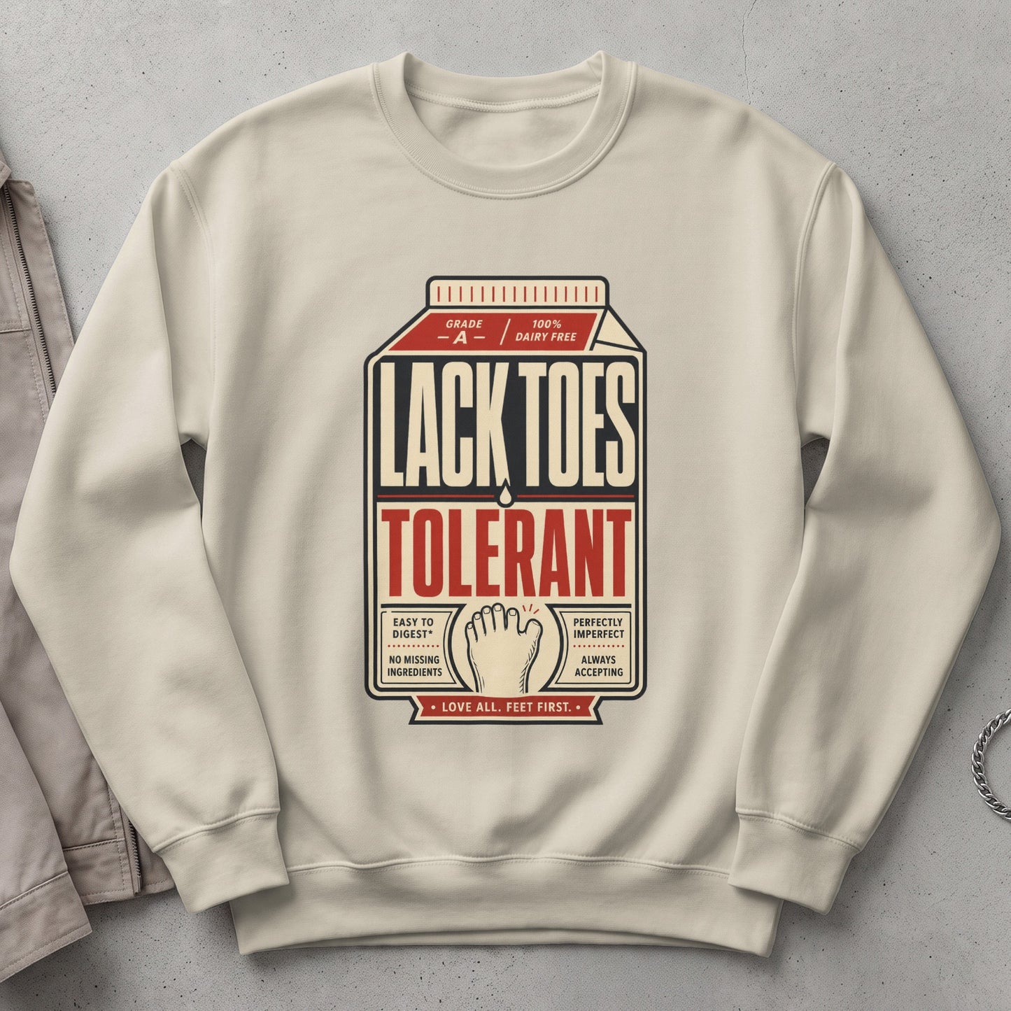 Cream sweatshirt with "Lack Toes Tolerant" text and foot illustration.