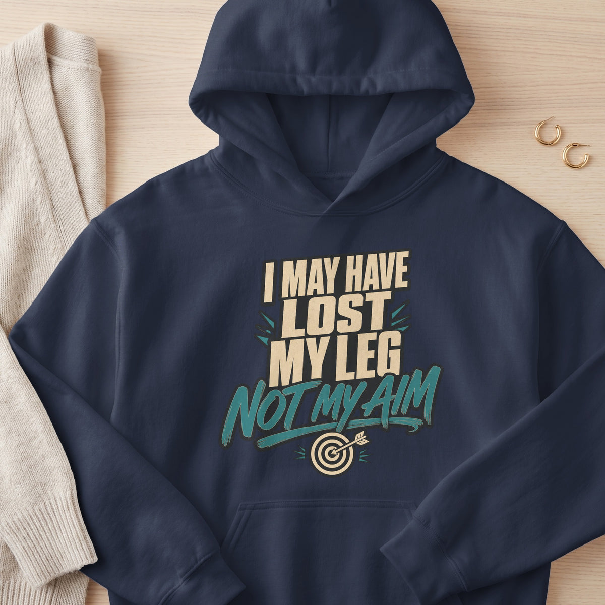 Navy hoodie with text "I MAY HAVE LOST MY LEG NOT MY AIM" and a dartboard.