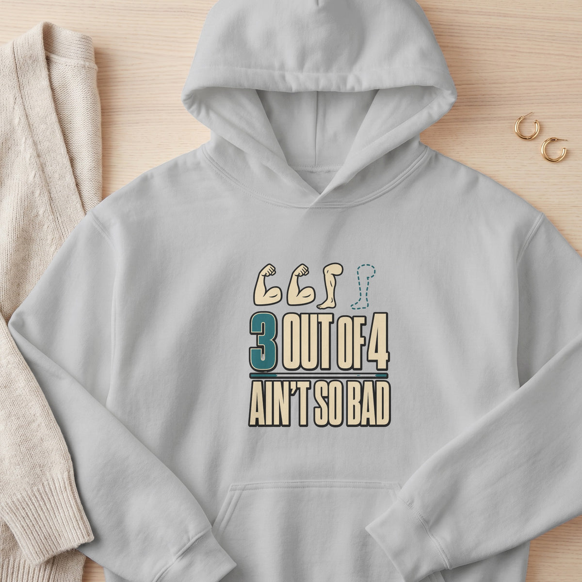 Gray hoodie with "3 OUT OF 4 AIN'T SO BAD" text and muscular arm graphics.