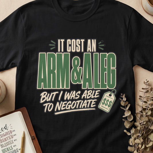 Black t-shirt with "IT COST AN ARM & A LEG BUT I WAS ABLE TO NEGOTIATE" text.