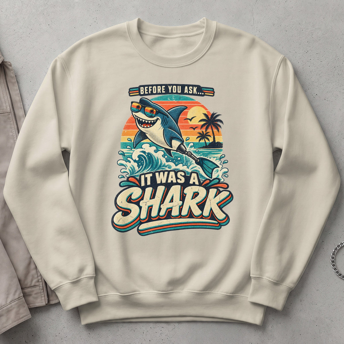 Retro shark with sunglasses surfs a wave with text "It Was A Shark".