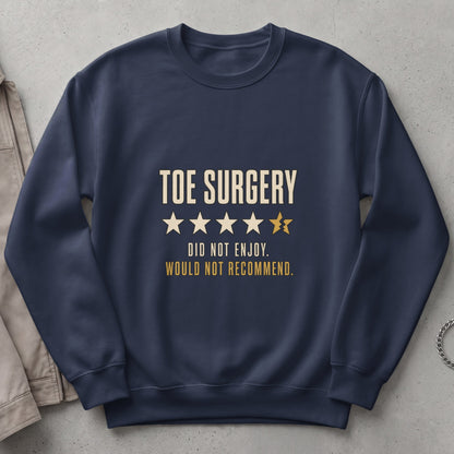 Dark blue sweatshirt with "TOE SURGERY" text and a broken star rating.