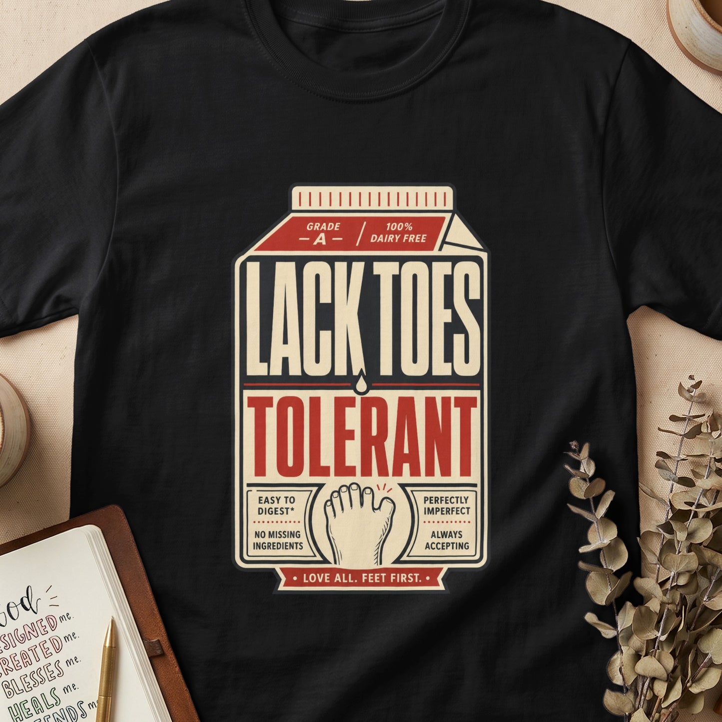 Black t-shirt with "Lack Toes Tolerant" in milk carton design.