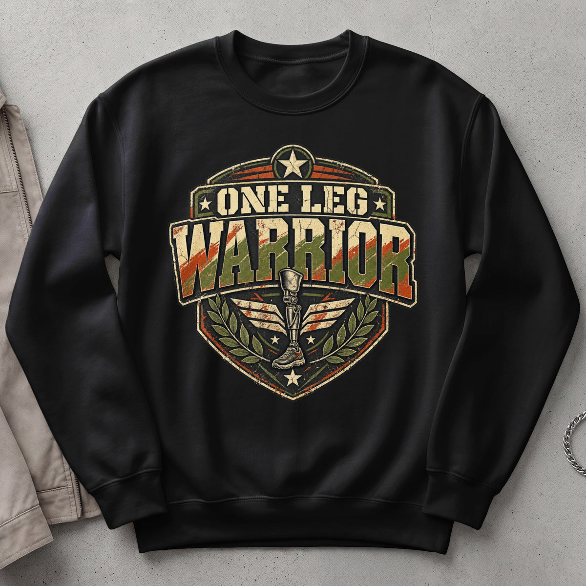 Black sweatshirt with "One Leg Warrior" text and prosthetic leg graphic.