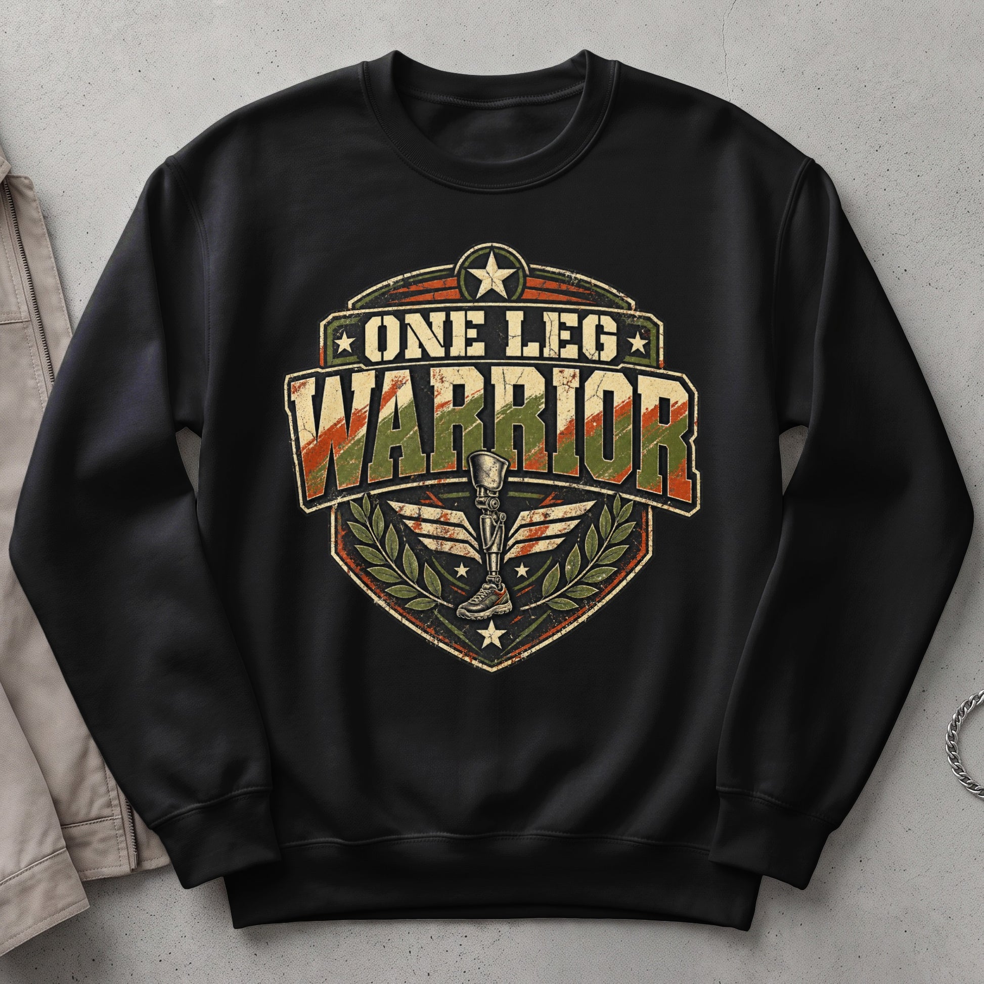 Black sweatshirt with "One Leg Warrior" text and prosthetic leg graphic.
