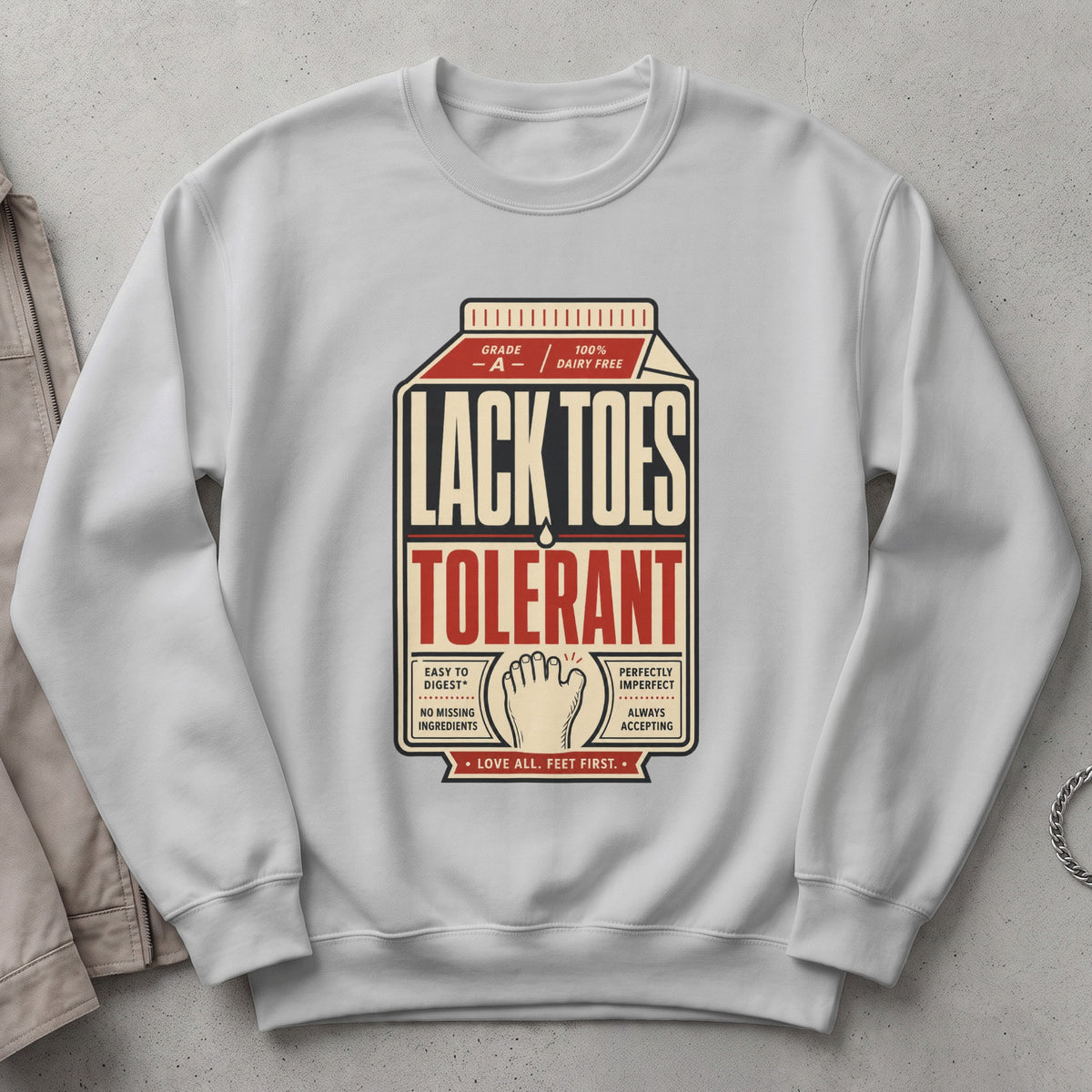 White sweatshirt with "Lack Toes Tolerant" text and foot graphic.