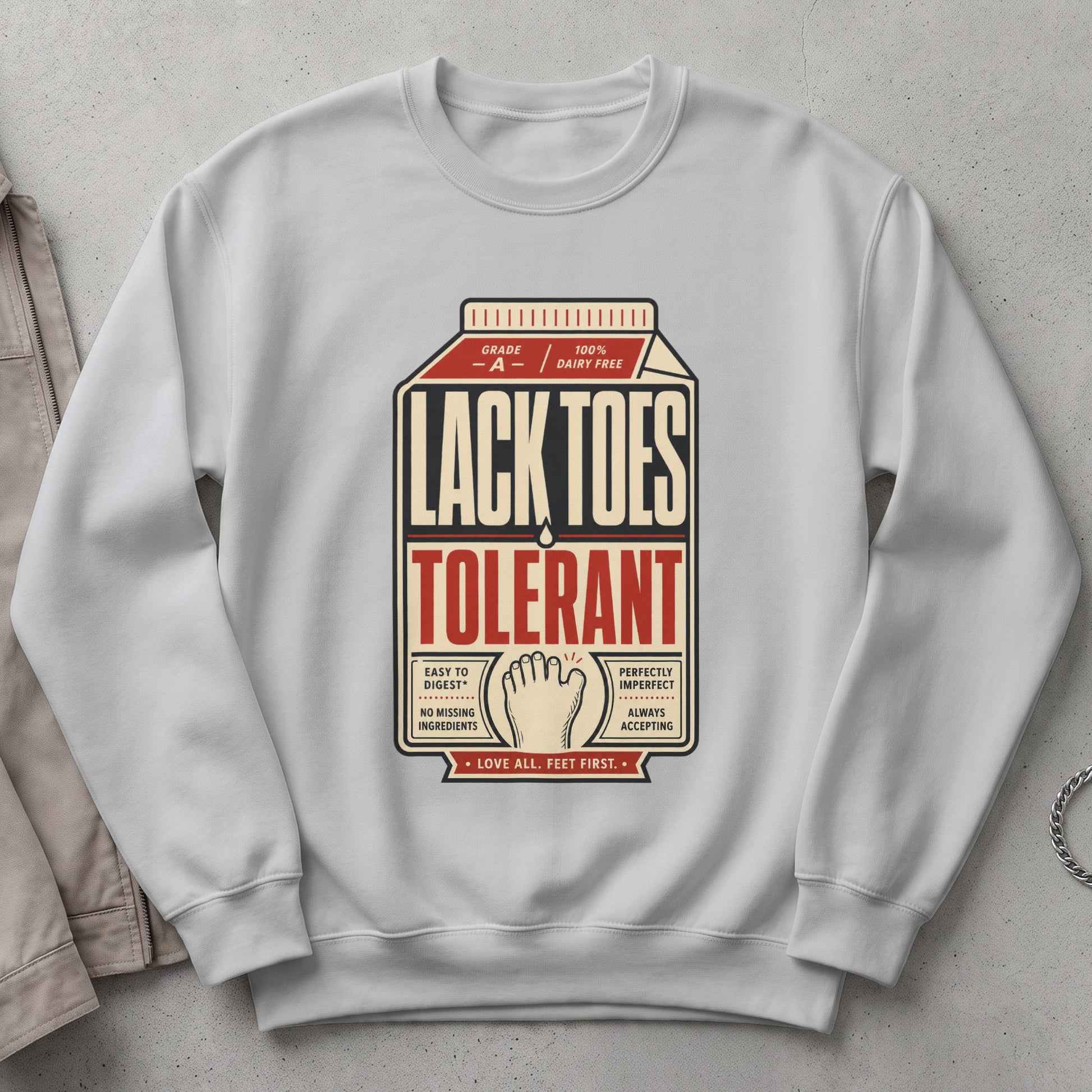 White sweatshirt with "Lack Toes Tolerant" text and foot graphic.